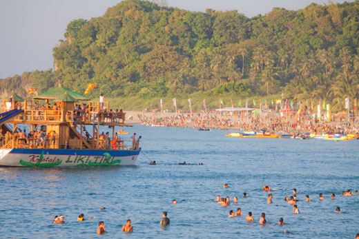 White Beach Puerto Galera Travelers and Floating Bar in Summer